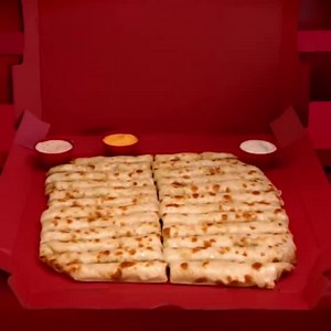 Topperstix™ are, by far, the most romantic item on our menu. They just are. Smothered in cheese, made for dipping–is it warm in here? Oh wait, that's just the oven. | Toppers Pizza