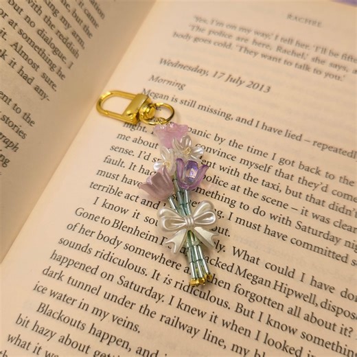 Resin | Crochet | Candles | Customized | Handmade | Beads on Instagram: "Handmade Bouquet Charms ✨️🌻 Tiny bouquets with big feelings 🌸✨ These handmade bouquet charms are crafted to capture love, warmth and special moments in the cutest form. Perfect for gifting, keepsakes or adding a soft floral touch to bags, keys and pouches. Each charm feels thoughtful, delicate and made straight from the heart 🤍 #whisperingbansuri • DM, call, WhatsApp, or text +91 76579 71156 for inquiries or orders. • Cu