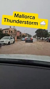 Heavy rain and strong winds are hitting Mallorca today as an orange weather alert has been issued across the island. Streets in Palma are already flooding, waves are crashing against the coast, and the sky is dark and full of thunder. Locals and tourists are advised to stay indoors and avoid driving unless necessary. The storm is expected to continue throughout the day, with intense rain and gusts creating dramatic scenes across the island. Mallorca is experiencing one of its strongest autumn st