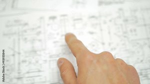 The hand (fingers) points on the blueprint engineering project
