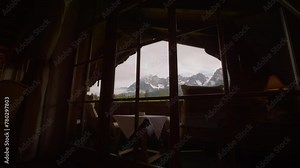 Incredible view from the hotel window and balcony to the mountains in the area. Nature viewed through the glass of a chalet in a resort.