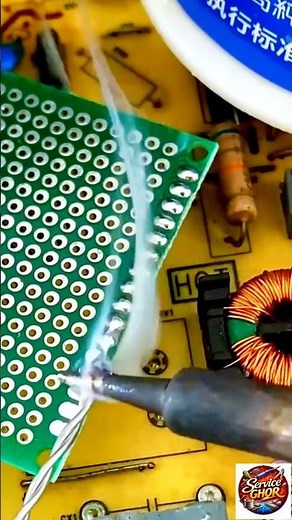 The video depicts the process of soldering electrical components to a printed circuit board (PCB)