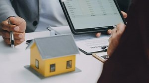 Download Real estate broker agent presenting and consult to customer to decision making sign insurance form agreement, buy and sell home model, concerning mortgage loan offer for and house insurance for free