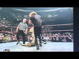 Brian Pillman Attacks Goldust from Behind with Gold Dress Marlena Mannequin During Rockabilly Match