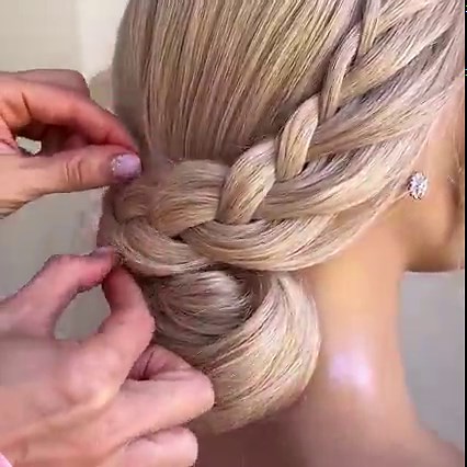 263K views · 331 reactions | A low bun with the cutest braid wrapped around it! Join the best online education platform for aspiring bridal hairstylists. https://ulyanaaster.com/education/ | Ulyana Aster | Facebook