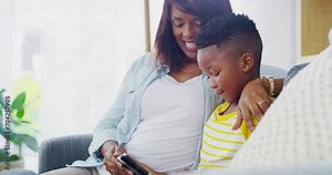 Child, mother and tablet on sofa in home to watch movies, play video games and educational multimedia. Happy mom, boy kid and black family streaming cartoon, digital ebook and elearning app in lounge