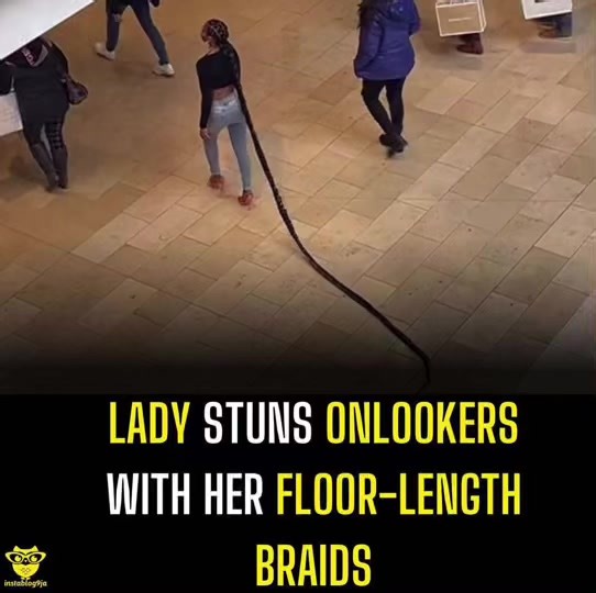 Lady stuns onlookers with her floor-length braids.