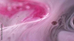 Oil serum. Ink water mix. Defocused pink color transparent round droplets floating gel texture liquid motion abstract art background.