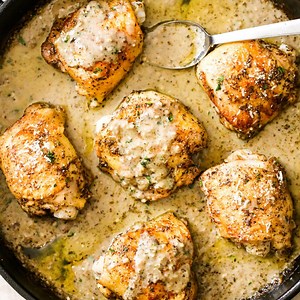 77K views · 581 reactions | One-pan creamy chicken thighs baked in garlic parmesan cream sauce are tender and juicy on the inside, and crispy on the outside. This delicious dish makes a perfect dinner in under 45 minutes with minimum prep and clean-up! Recipe + macros: https://gimmedelicious.com/chicken-baked-in-garlic-parmesan-cream-sauce | GimmeDelicious | Facebook