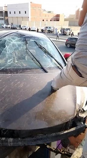 Damaged Sedan Inspection: Shattered Windshield Details