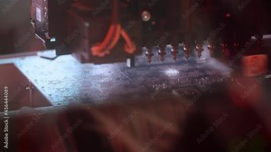 Close-up automated electronic circuit board production. Machine robot produces digital board. Manufacture production of electronic chips. Assembling with robotic arm. Automatic SMT pick and place