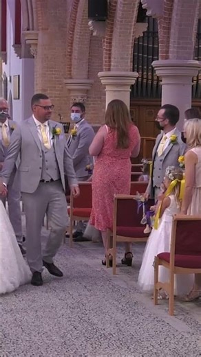 bride and groom walk up the aisle