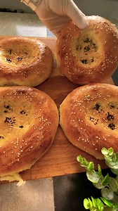 Quick Uzbek Bread Recipe Ingredients: 1.5 cups warm milk or water 1 tbsp sugar 1.5 tsp active dry yeast 2 tbsp melted butter 4 cups all-purpose flour 1.5 tsp salt 1 egg yolk 1 tbsp milk (for egg wash) Sesame or nigella seeds for topping Instructions: Proof Yeast:Mix warm milk, sugar, and yeast. Let it sit for 5 minutes until foamy. Make Dough: In a large bowl, combine flour and salt. Add the yeast mixture and melted butter. Mix and knead for 5-10 minutes until the dough is smooth and elastic. Ri