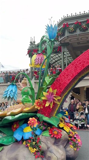 Colorful Disney parade with Captain Hook and Tinker Bell.