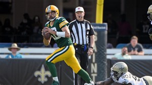 Aaron Rodgers took a 'double nut shot' on his first interception, the Packers quarterback tells Pat McAfee on his Tuesday radio show
