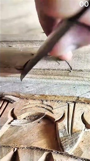 Chisel carves intricate patterns into wooden surface