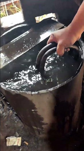 The large knife is soaked in water after heating to harden blade and increase its overall strength