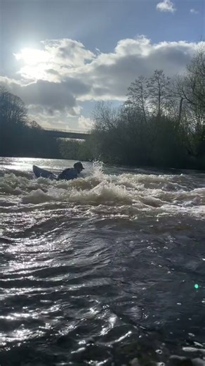 Surfing spring rapids in the last light of day