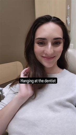 She's trying so hard to hide those tits, but they're so huge and full!