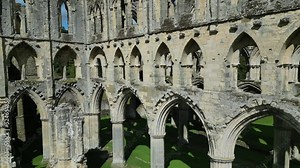 Rievaulx Abbey ree-VOH was a Cistercian abbey in Rievaulx, situated near Helmsley in the North York Moors National Park, North Yorkshire, England