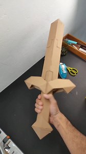 57K views · 3.4K reactions | A sturdy cardboard sword made from thin 1.5mm cardboard sheet. Inspired by minecraft. The cardboard sword length is 65cm. It use triangular prism construction to make it sturdy. Let me know what you think. #cardboardcraft #cardboardsword #cardboardprops #cardboardtoys #cardboardart | KRAF Studio | Facebook