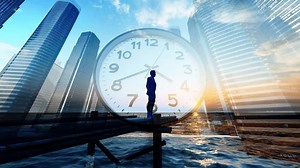 High-end office building and clock time change with businessman back view