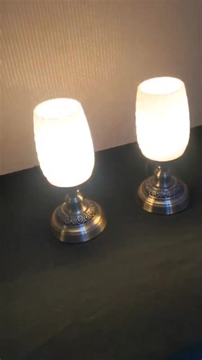RS 4500 Divinecrafts New Pair Of Glass Lamps ☎️ 03111100230 🔥 Self Pick-up or Charged Delivery 🔥 ✨ DivineCrafts | Brand New Glass Table Lamps (Pair) ✨ Elevate your space with timeless elegance and ambient charm. This brand new pair of glass table lamps from DivineCrafts is designed to complement both classic and modern interiors. 🔸 Premium frosted glass shades with elegant spiral texture 🔸 Metal base in antique brass finish with intricate detailing 🔸 Soft ambient glow – perfect for bedrooms