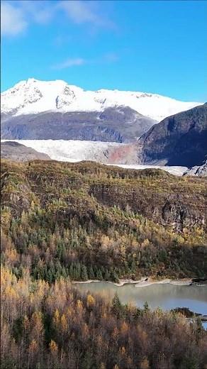 Mendenhall Glacier rises behind a wall of ancient Tongass rainforest in Juneau, Alaska