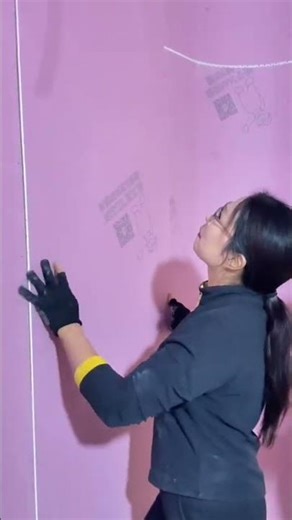 installation of a plywood board on a wall is done by an expert