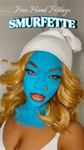 AWOO🌎💜 on Instagram: "WELCOME TO FREE HAND FRIDAYS👩🏽‍🎨 DAY 1: SMURFETTE🩵 #awoosworld #freehandfridays #facepaint #unrecognizablemakeup #trend #makeuptutorial #trendingreels #halloweenmakeup #facepainttutorial #smurf #smurfette"