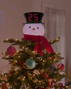 Our adorable Countdown to Christmas Tree Topper projects magical snowflakes onto your ceiling while displaying the numbers of days until Christmas. Find the finishing touch to your tree today in stores and online: https://bit.ly/CountdownTopper | Hallmark Gold Crown Stores