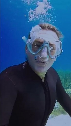 Rubber Frogwoman Blowing Bubbles Underwater