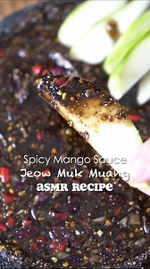 Lao Jeow Muk Muang. Spicy Savory Mango 🥭 Sauce. ASMR Mukbang Recipe 🌶️🔥. For those who never had this. The Flavors are Spicy, Savory, Sweet, Tangy, Nutty, with the Perfect Amount of Saltiness. Delicious, Addicting, and a Great Way for a Natural Detox. Recipe: 3/4 Cup of Palm Sugar 1/4 Cup of Sugar 1/4 Cup of Toasted Rice Powder 1/2 Cup of Fish Sauce 1/2 Tsp of MSG 3 Tbsp of Chili Powder 1 Tbsp of Shrimp Paste or Padaek Instructions 📝 1. In a Small Bowl. Combine all of the ingredients Listed 