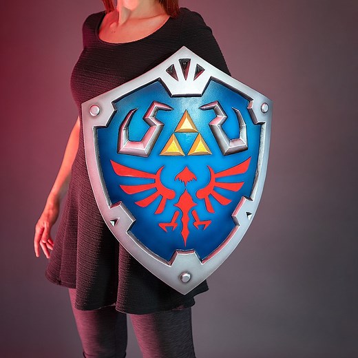 992K views · 15K reactions | I LOVE Legend of Zelda and the Hylian shield is one of my favorite props! So I built one out of simple foam completely from scratch!  It only took me a couple of days of work and my husband helped with the painting. It was SUPER FUN! What's your favorite Zelda game? 栗 | Kamui Cosplay | Facebook