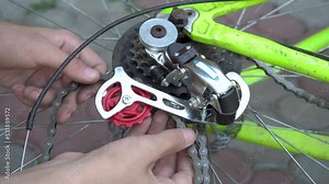 installing a chain on a bicycle,chain replacement on a mountain bike, bike repair
