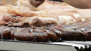 Grilled ribs and black pudding, Argentine food Stock Video