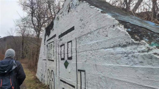This is apparently the former bridge site where the Johnstown Traction Company trolley line crossed the Stonycreek River and the Johnstown and Stonycreek Railroad just below Moxham Pennsylvania. Only one through truss span remains of the bridge over the river. The trolley operated from 1910 to 1960. | Metrotrails