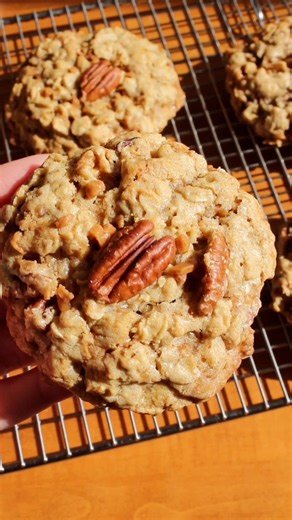 9.5K views · 62 reactions | ⬇️ Recipe below!  Oatmeal Toffee Pecan Cookies are thick and chewy cookies full of hearty oats, sweet toffee, nutty pecans, and brown sugar. The pairing of toffee and pecans is so delicious. 勺 Get the recipe below or comment RECIPE in the comments and I’ll send it directly to your inbox! 殺 #baking #toffee #oatmealcookies #PecanLovers #chocolatechipcookies #cookies #cookietime | Taffey Bakery | Facebook
