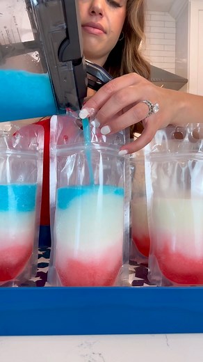 RED, WHITE AND BLUE DRINK POUCHES! These are so fun to make for 4th of July! I made frozen margaritas but you can swap this out and use any kind of drink mixes blended with ice. I used strawberry and pina colada mix and some blue curaco mixed with lime juice. Red Layer 3-4 cups ice strawberry or watermelon drink mix (i made frozen margaritas but you can do any drink frozen) tequila (or any other drink of choice I did about 2.5 oz) White Layer 3-4 cups ice pina colada mix tequila (about 2.5 ounce