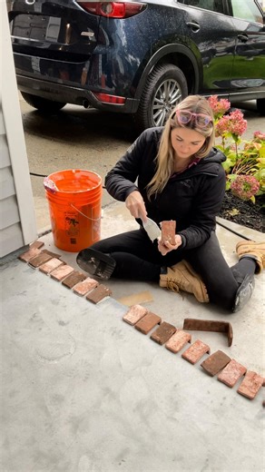 Theresa Vanderstar | DIY & Cabinetry Builds on Instagram: "He doubts the vision… but I always win him over in the end 💁🏼‍♀️ This front stoop started off with zero personality and ended up with a thin brick veneer makeover that completely changed the look of our home. I love how small exterior updates can make the biggest impact. Brick adds texture, warmth, and that timeless look I’m always chasing in our renovations. Follow along for real-life DIY home renovation projects, epic makeovers, and