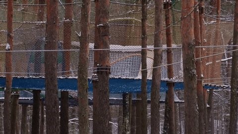 clip-3973853299-ropes-course-forest-adventure-park-during-winter