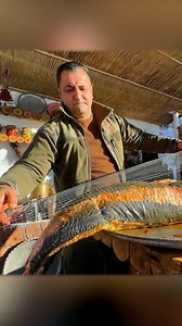 🐟 A giant fish, stuffed with aromatic ingredients, slowly smoking in a barrel. Deep aroma and rich taste – another culinary masterpiece from Wilderness Cooking! #wildernesscooking #smokedfish #outdoorcooking #traditionalrecipes | Wilderness Grill