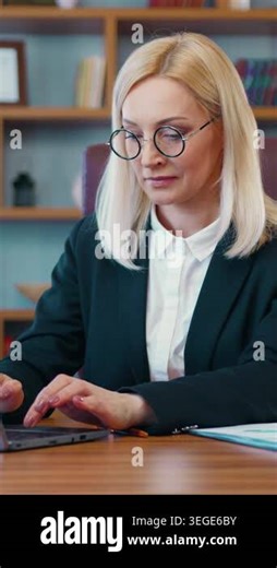 Beautiful blonde businesswoman in business clothes works at the computer in the office. Slow mition 4k Stock Video Footage - Alamy