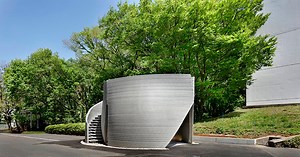 spiral staircase wraps around the sculptural 3D-printed body of 3dpod in tokyo