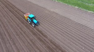 A blue tractor working on the fields - Free Stock Video
