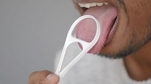 Download How to effectively use a tongue cleaner for oral hygiene for free