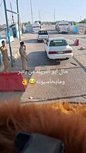 Checkpoint Scene with Security Personnel and Vehicles