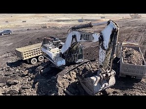 Caterpillar 375 Excavator Loading Trucks With Three Passes