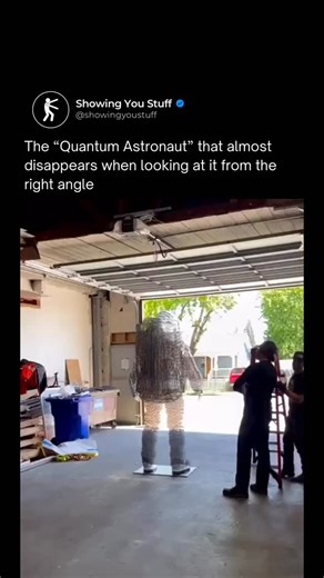 Showing You Stuff | Interesting Facts & Knowledge on Instagram: "Julian Voss-Andreae’s “Quantum Astronaut” is a stunning masterpiece that uses “parallel slices” to explore the nature of reality and human perception. Depending on where you stand, the sculpture completely disappears into its surroundings or manifests as a solid, shimmering figure. It’s a literal representation of quantum physics—reminding us that the universe is made of more empty space than solid matter. The sculpture is composed