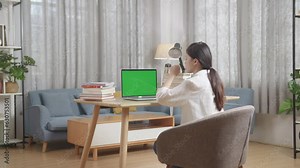 Bored Asian Teenager Yawning And Sleep With Green Mock Up Screen Laptop At Home While Doing Home Work, Child Learning Online